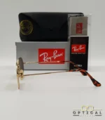 Lunettes de soleil Ray-Ban Octagonal RB3556 dorées avec verres marrons, étui noir, boîte et certificat Luxottica.