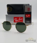 Lunettes de soleil Ray-Ban Jack RB3565 dorées avec verres verts G-15, étui noir, boîte grise et livret de garantie chez Optical Gallery.