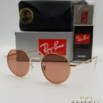 Lunettes de soleil Ray-Ban Jack RB3565 dorées avec verres roses marrons clairs, étui noir, boîte grise et livret de garantie chez Optical Gallery.