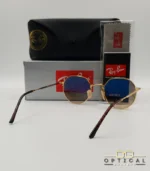 Lunettes de soleil Ray-Ban Jack RB3565 dorées avec verres dégradés marrons, étui noir, boîte grise et livret de garantie chez Optical Gallery.