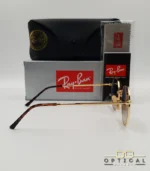 Lunettes de soleil Ray-Ban Jack RB3565 dorées avec verres dégradés marrons, étui noir, boîte grise et livret de garantie chez Optical Gallery.