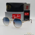 Lunettes de soleil Ray-Ban Jack RB3565 dorées avec verres dégradés bleus, étui noir, boîte grise et livret de garantie chez Optical Gallery.