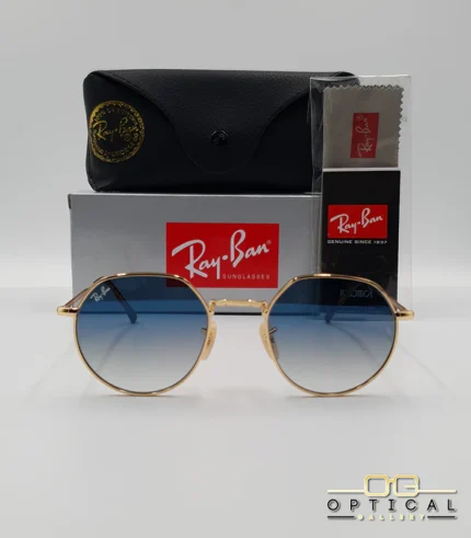 Lunettes de soleil Ray-Ban Jack RB3565 dorées avec verres dégradés bleus, étui noir, boîte grise et livret de garantie chez Optical Gallery.