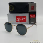 Lunettes de soleil Ray-Ban Jack RB3565 dorées avec verres noirs, étui noir, boîte grise et livret de garantie chez Optical Gallery.