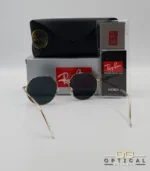 Lunettes de soleil Ray-Ban Jack RB3565 dorées avec verres noirs, étui noir, boîte grise et livret de garantie chez Optical Gallery.