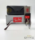 Lunettes de soleil Ray-Ban Jack RB3565 argentées avec verres dégradés bleus gris, étui noir, boîte grise et livret de garantie chez Optical Gallery.