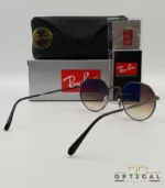 Lunettes de soleil Ray-Ban Jack RB3565 grises métalliques avec verres dégradés marrons, étui noir, boîte d'origine et livret de garantie chez Optical Gallery.