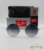 Lunettes de soleil Ray-Ban Jaio RB3592 argentées à grands verres ronds dégradés bleus gris, étui noir, boîte grise et livret de garantie chez Optical Gallery.