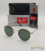 Lunettes de soleil Ray-Ban New Round RB3637 dorées avec verres verts G-15, étui noir, boîte grise et livret de garantie chez Optical Gallery.