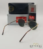Lunettes de soleil Ray-Ban New Round RB3637 dorées avec verres verts G-15, étui noir, boîte grise et livret de garantie chez Optical Gallery.