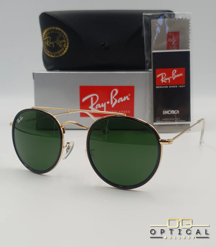 lunettes-de-soleil-ray-ban-round-double-bridge-rb3647n-or-noir-vert-g15-optical-gallery Lunettes de soleil Ray-Ban Round Double Bridge RB3647N dorées avec cerclages en acétate noir et verres verts G-15, étui noir, boîte grise et livret de garantie chez Optical Gallery.