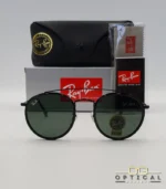 Lunettes de soleil Ray-Ban Round Double Bridge RB3647N noires avec cerclages en acétate noir et verres verts G-15, étui noir, boîte grise et livret de garantie chez Optical Gallery.