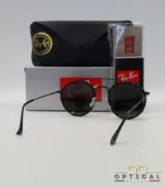 Lunettes de soleil Ray-Ban Round Double Bridge RB3647N noires avec cerclages en acétate noir et verres verts G-15, étui noir, boîte grise et livret de garantie chez Optical Gallery.