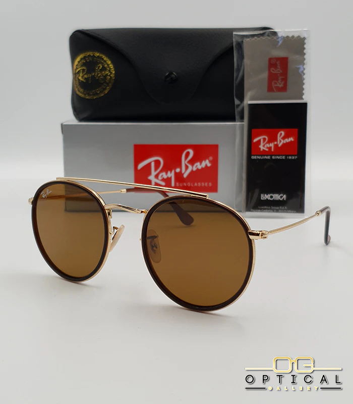 lunettes-de-soleil-ray-ban-round-double-bridge-rb3647n-or-marron-optical-gallery Lunettes de soleil Ray-Ban Round Double Bridge RB3647N dorées avec cerclages en acétate marron et verres marrons B-15, étui noir, boîte grise et livret de garantie chez Optical Gallery.