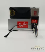 Lunettes de soleil Ray-Ban Round Double Bridge RB3647N argentées avec cerclages en acétate noir et verres dégradés bleus gris, étui noir, boîte grise et livret de garantie chez Optical Gallery.