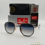 Lunettes de soleil Ray-Ban Marshal II RB3648M dorées avec cerclages en acétate bleu marine et verres dégradés bleus gris, étui noir, boîte grise et livret de garantie chez Optical Gallery.