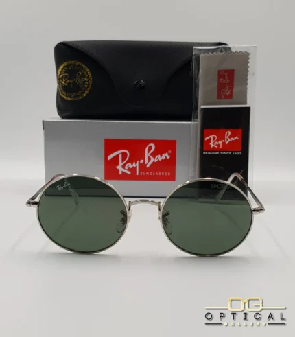 Lunettes de soleil rondes Ray-Ban RB1970 dorées avec verres verts, présentées avec leur étui en cuir noir, leur boîte et le logo Optical Gallery.
