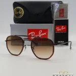 Lunettes de soleil Ray-Ban Marshal II RB3648M marrons avec cerclages en acétate marron et verres dégradés marrons, étui noir, boîte grise et livret de garantie chez Optical Gallery.
