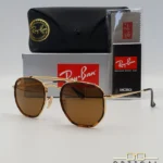 Lunettes de soleil Ray-Ban Marshal II RB3648M dorées avec cerclages en acétate écaille de tortue et verres marrons B-15, étui noir, boîte grise et livret de garantie chez Optical Gallery.