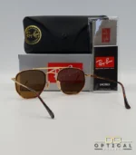 Lunettes de soleil Ray-Ban Marshal II RB3648M dorées avec cerclages en acétate écaille de tortue et verres marrons B-15, étui noir, boîte grise et livret de garantie chez Optical Gallery.