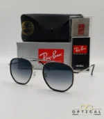 Lunettes de soleil Ray-Ban Marshal II RB3648M argentées avec cerclages en acétate noir et verres dégradés bleus gris, étui noir, boîte grise et livret de garantie chez Optical Gallery.