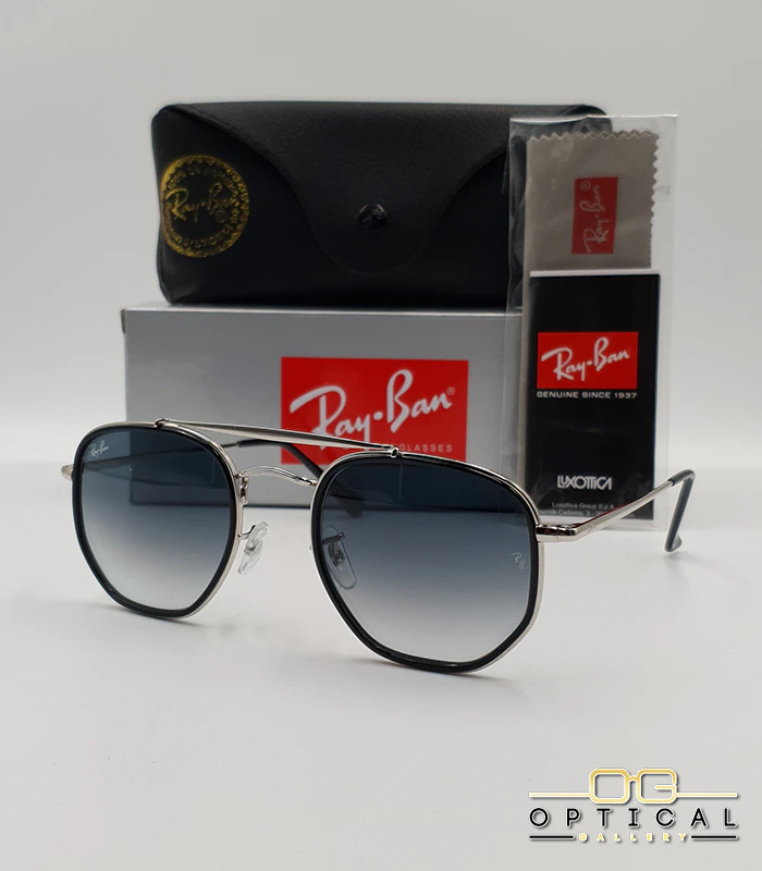 lunettes-de-soleil-ray-ban-marshal-ii-rb3648m-argent-noir-bleu-degrade-optical-gallery Lunettes de soleil Ray-Ban Marshal II RB3648M argentées avec cerclages en acétate noir et verres dégradés bleus gris, étui noir, boîte grise et livret de garantie chez Optical Gallery.