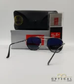 Lunettes de soleil Ray-Ban Marshal II RB3648M argentées avec cerclages en acétate noir et verres dégradés bleus gris, étui noir, boîte grise et livret de garantie chez Optical Gallery.