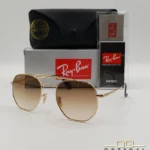 Lunettes de soleil Ray-Ban Marshal II RB3648M dorées avec verres dégradés marrons, étui noir, boîte grise et livret de garantie chez Optical Gallery.