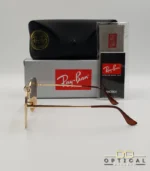 Lunettes de soleil Ray-Ban Marshal II RB3648M dorées avec verres dégradés marrons, étui noir, boîte grise et livret de garantie chez Optical Gallery.