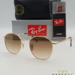 Lunettes de soleil Ray-Ban Julie RB3772 dorées avec verres dégradés marrons, étui noir, boîte grise et livret de garantie chez Optical Gallery.