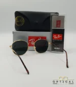 Lunettes de soleil Ray-Ban Julie RB3772 dorées avec verres verts G-15, étui noir, boîte grise et livret de garantie chez Optical Gallery.