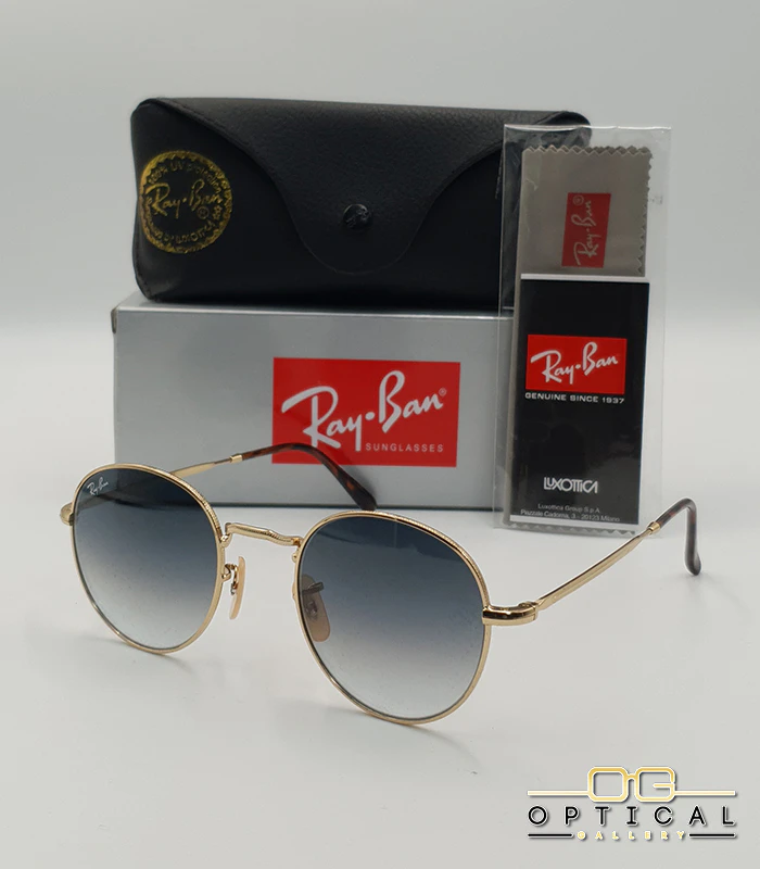 lunettes-de-soleil-ray-ban-julie-rb3772-or-bleu-degrade-optical-gallery Lunettes de soleil Ray-Ban Julie RB3772 dorées avec verres dégradés bleus gris, étui noir, boîte grise et livret de garantie chez Optical Gallery.