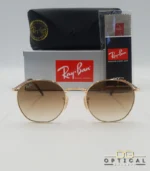 Lunettes de soleil Ray-Ban Julie RB3772 dorées avec verres dégradés marrons, étui noir, boîte grise et livret de garantie chez Optical Gallery.