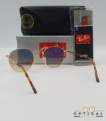 Lunettes de soleil Ray-Ban Julie RB3772 dorées avec verres dégradés marrons, étui noir, boîte grise et livret de garantie chez Optical Gallery.