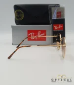 Lunettes de soleil Ray-Ban Julie RB3772 dorées avec verres dégradés marrons, étui noir, boîte grise et livret de garantie chez Optical Gallery.