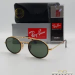 Lunettes de soleil Ray-Ban Round Double Bridge RB3847N dorées avec cerclages en acétate écaille de tortue et verres verts G-15, étui noir, boîte grise et livret de garantie chez Optical Gallery.