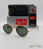 Lunettes de soleil Ray-Ban Round Double Bridge RB3847N dorées avec cerclages en acétate écaille de tortue et verres verts G-15, étui noir, boîte grise et livret de garantie chez Optical Gallery.