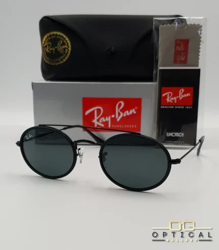 Lunettes de soleil Ray-Ban Round Double Bridge RB3847N noires avec cerclages en acétate noir et verres dégradés bleus gris, étui noir, boîte grise et livret de garantie chez Optical Gallery.