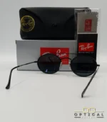 Lunettes de soleil Ray-Ban Round Double Bridge RB3847N noires avec cerclages en acétate noir et verres dégradés bleus gris, étui noir, boîte grise et livret de garantie chez Optical Gallery.
